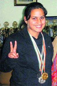 Ace skater Sonali Devgan wears the three medals she won at the 49th Open National Roller Skating Championship-2012