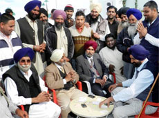 Former DGP Paramdeep Singh Gill who is in the fray from Moga as SAD candidate relaxes with his supporters after the polls.