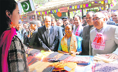 Lok Sabha Speaker Meira Kumar, Union Minister for Tourism Subodh Kant Sahay, Haryana and Assam Chief Ministers Bhupinder Singh Hooda and Tarun Gogoi visit the Pakistan stall at the Surajkund crafts mela on Wednesday. 
