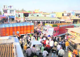 Residents of Tahliwal village in Una district block traffic against the leakage of gas from an industrial unit on Wednesday