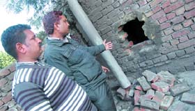 The hole made by miscreants in the outer wall of a factory in Jalandhar