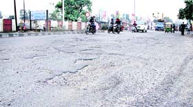 Potholes on the stretch leading from Rama Mandi Chowk to PAP Chowk in Jalandhar