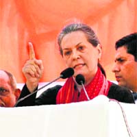 Congress president Sonia Gandhi addresses a poll rally in Gonda district on Wednesday