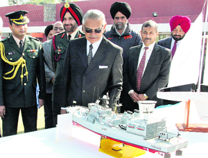 Shivraj Patil, UT Administrator and Governor of Punjab, inspects the model of a ship displayed by NCC cadets at Punjab Raj Bhavan in Chandigarh on Thursday.