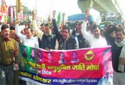 Members of the SC wing of the Delhi BJP protest against the alleged civil supplies scam in the Delhi government