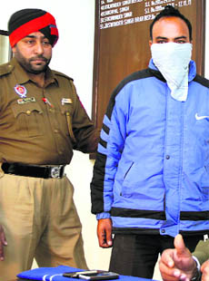 Constable Manjit Singh in police net in Jalandhar on Thursday. 