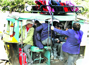 An overloaded auto-rickshaw ferry schoolchildren in Jalandhar on Thursday. 
