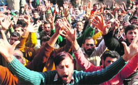 Members of the Jammu and Kashmir PDD Daily Wagers Union protest in support of their demands in Jammu on Thursday.