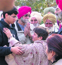 Relatives console his son.