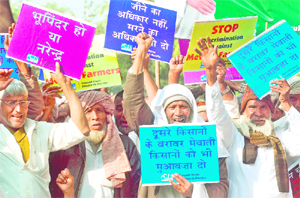 Mewat farmers shout anti-Hooda government slogans during a demonstration in protest against land acquisition outside Haryana Bhawan in New Delhi on Friday. 