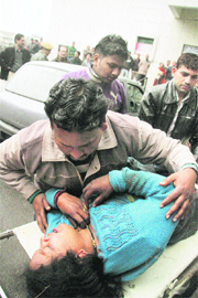 A woman, who was injured in a bus accident at Nandani, being shifted to the Government Medical College and Hospital in Jammu on Friday.