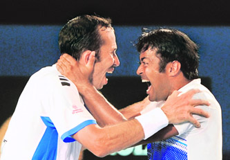 Leander Paes and Radek Stepanek of the Czech Republic celebrate winning a point in their Men's Doubles final against Bob and Mike Bryan of the US in Australian Open in Melbourne.