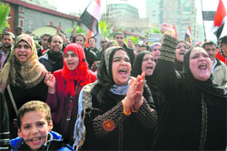 Egyptian protesters shout slogans against the ruling military during a protest in the coastal city of Alexandria on Friday.