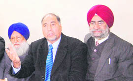 Dilwinder Singh Dhoot (middle), chairman of NAPA, addresses mediapersons in Amritsar on Saturday.