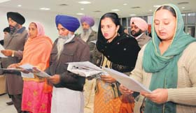 Newly elected members of the zila parishad and panchayat samiti take oath at the UT guest house in Chandigarh on Saturday