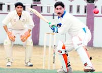 A batsman in action in a match in the 60th Dehradun District Cricket League in Dehradun 