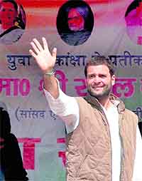 Congress general secretary Rahul Gandhi waves to crowds at an election rally in Varanasi on Saturday
