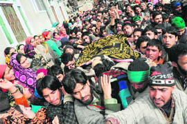 Villagers carry suspected militant Ashiq Ahmad Shahs body during a funeral procession at Panzgam, 52 km south of Srinagar, on Saturday. 