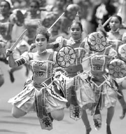 Traditional dancers perform during a parade celebrating the 64th Independence Day in Anuradhapura (Sri Lanka)