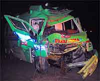 The badly mangled remains of the ambulance that rammed into tree on Sunday