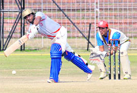 Hemant Dogra plays a shot during a cricke match in Chandigarh on Sunday. 