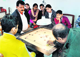 Players in action during a carrom game at Government College, Sector 14, Panchkula, on Sunday. 