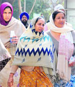 Relatives accompany Gurdial Singhs wife (centre) at the Government Multi-Speciality Hospital at Sector 16 of Chandigarh on Sunday. 
