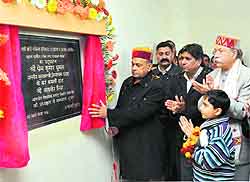 Chief Minister PK Dhumal inaugurates a parking lot at Gagrate in Una on Sunday