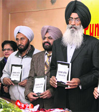 Daljit Singh, Director, Doordarshan, releases a book on the history of Doordarshan in Jalandhar on Sunday. 