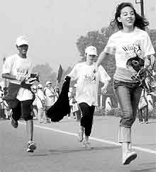 Participants at "Walk for Life", a programme organised for cancer awareness, at the Rajpath near India Gate in New Delhi on Sunday