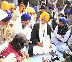 The Jathedar of Takht Damdama Sahib shows the Akal Takht edict against Dera Sacha Sauda in Bathinda