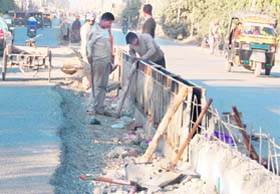A divider on Majitha Road being refurbished in Amritsar