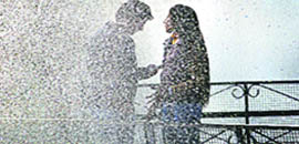 Fountain of delight: Drops of water add colour to precious moments of a young couple at the Zakir Rose Garden in Sector 16 of Chandigarh