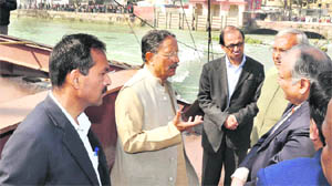 Uttarakhand Chief Minister BC Khanduri inspecting the collapsed bridge over the Ganga canal at Roorkee on Monday. 