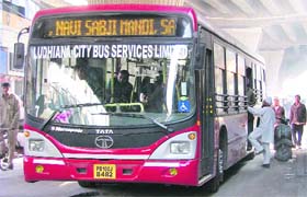A man boards a city bus near Mata Rani Chowk in Ludhiana
