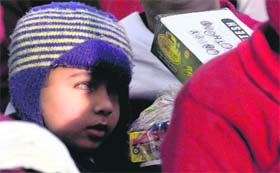 Relatives of Satish Sharma present gifts to a blind child at VRTC in Ludhiana