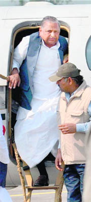 Samajwadi Party chief Mulayam Singh alights from a chopper in Azamgarh on Monday. 