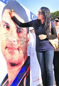 Yuvraj Singh’s fans write messages for his wellbeing on his poster at Sector 17, Chandigarh, on Tuesday