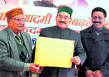 BBL Butail (left) hands over the Renuka bypoll report to Kaul Singh Thakur, state Congress chief, at the Congress office in Shimla on Tuesday