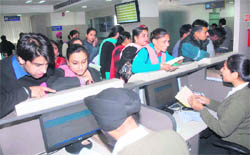 Applicants submit documents at a Passport Sewa Kendra in Jalandhar