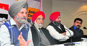 Paramjit Singh (left), general secretary, Grewal Sports Association, Kila Raipur, and others at a press meet in Ludhiana. 