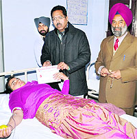 A student at a blood donation camp held at Khalsa College in Amritsar on Wednesday