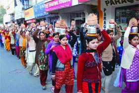 Devotees take part in Kalash Yatra in Bathinda on Wednesday. 