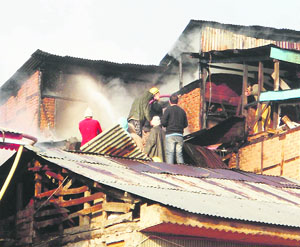 Firefighters at work at the mishap site in the Basant Bagh area of Srinagar on Wednesday. 