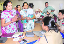 A deserted wife of an NRI narrates her tale of woe to senior police officials at a public hearing in the Police Lines in Jalandhar. 