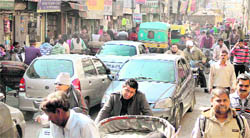Traffic jams at the Mai Hiran Gate (above) and one-way Jail Road (right) in Jalandhar. 