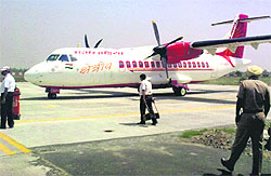 An Air India flight stands on the runway at Sahnewal Airport in Ludhiana
