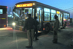 The police instructs drivers of other buses to move on and not stop at the spot of confrontation