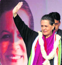 Congress president Sonia Gandhi waves to supporters at a rally in Allahabad on Wednesday. 