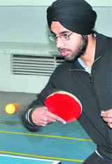 Manpreet Singh of SGGS College, Sector 26, plays a shot during the final match of the Inter-College Table Tennis Tournament in Chandigarh on Thursday.